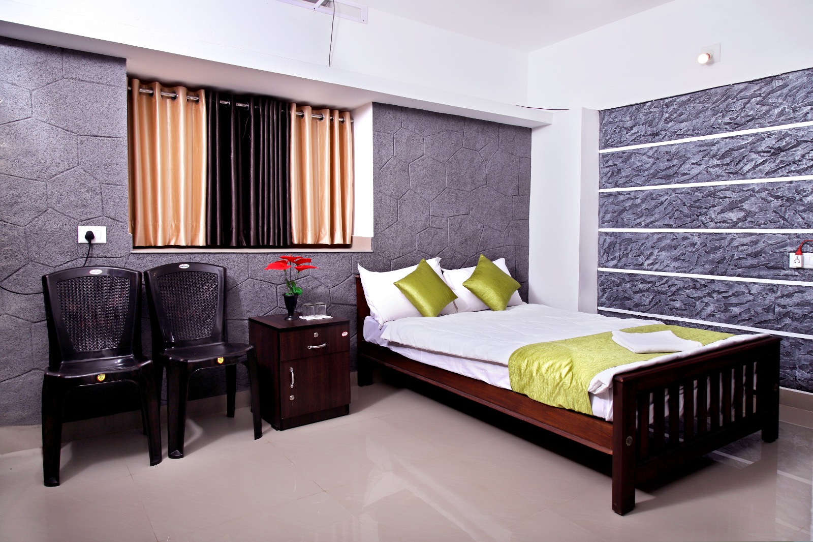 Comfortable master bedroom with queen bed and modern amenities at Bhaskar Home